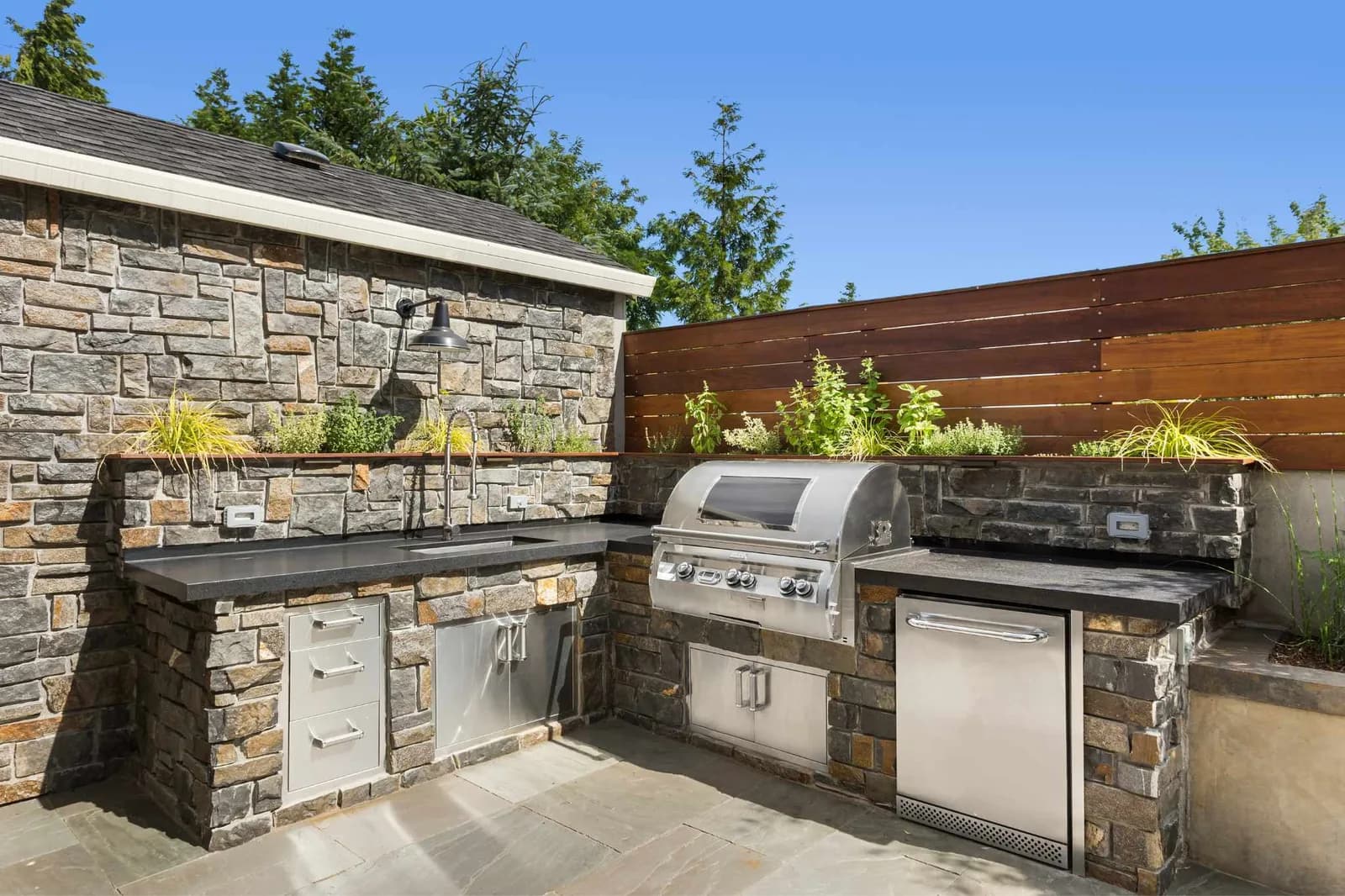 Outdoor kitchen prep station with stainless steel countertop