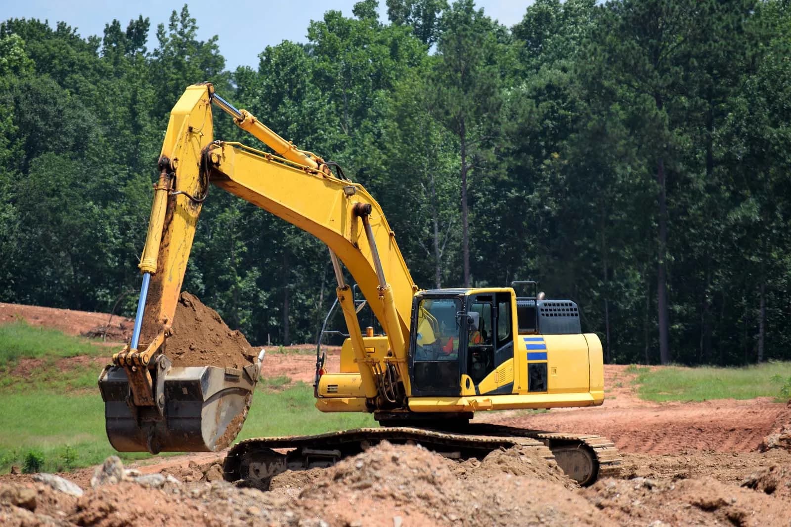 Excavator doing site work for an ADU build
