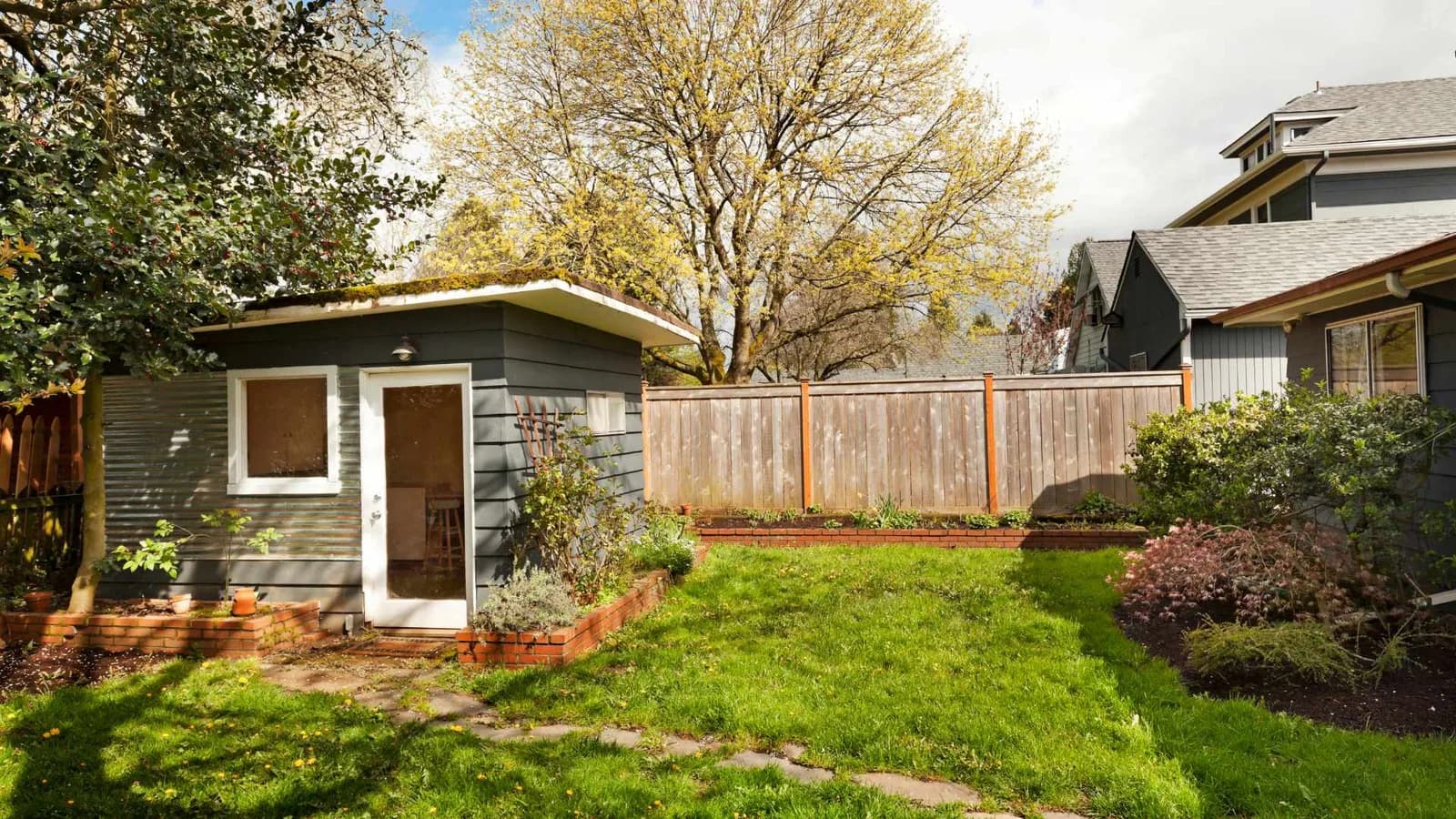 Backyard shed standing in a residential yard