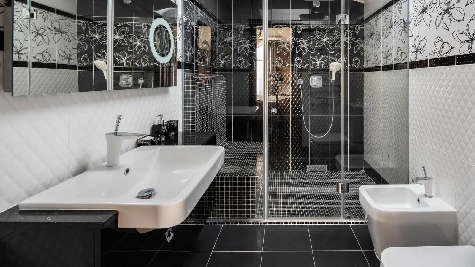 bathroom with walk in shower and bidet