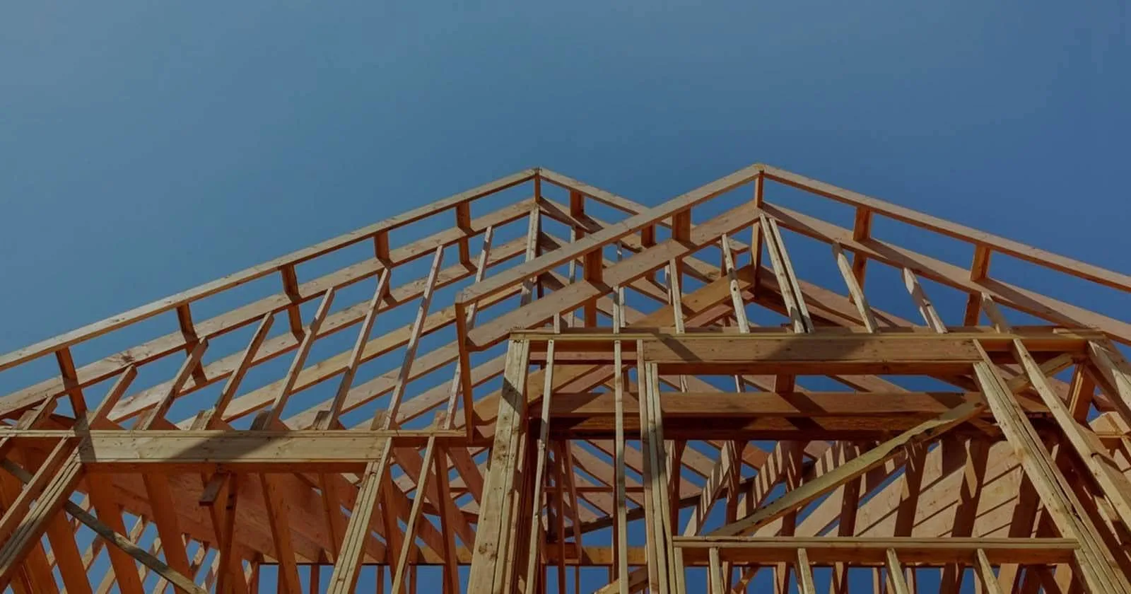 Wood roof framing of a house under construction
