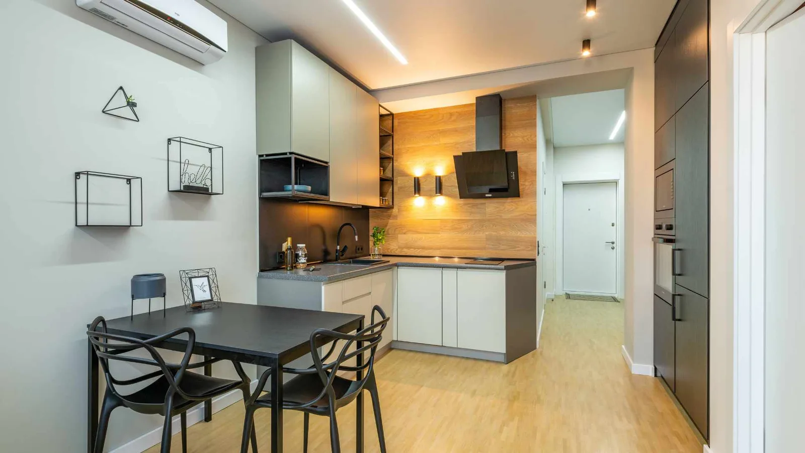 Compact full kitchen with an attached dining table