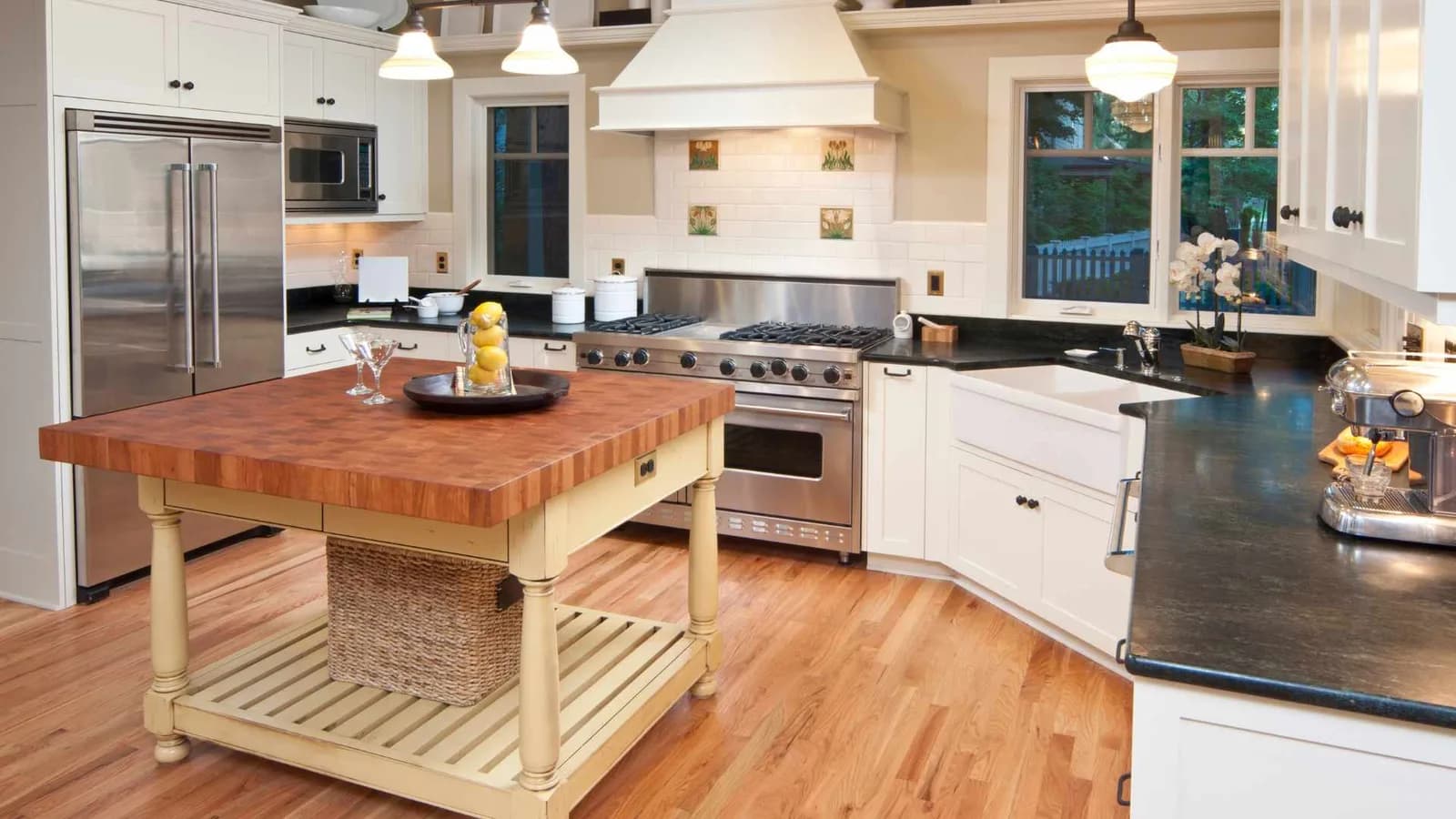 Corner ADU kitchen with a movable island on wheels