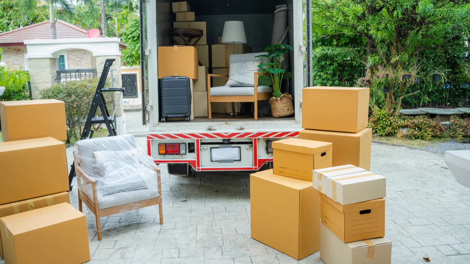 movers' truck with loaded household goods