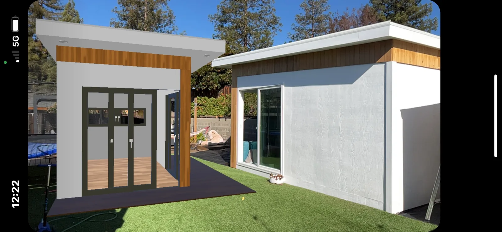 Augmented reality filter preview of the office pod next to the real backyard studio