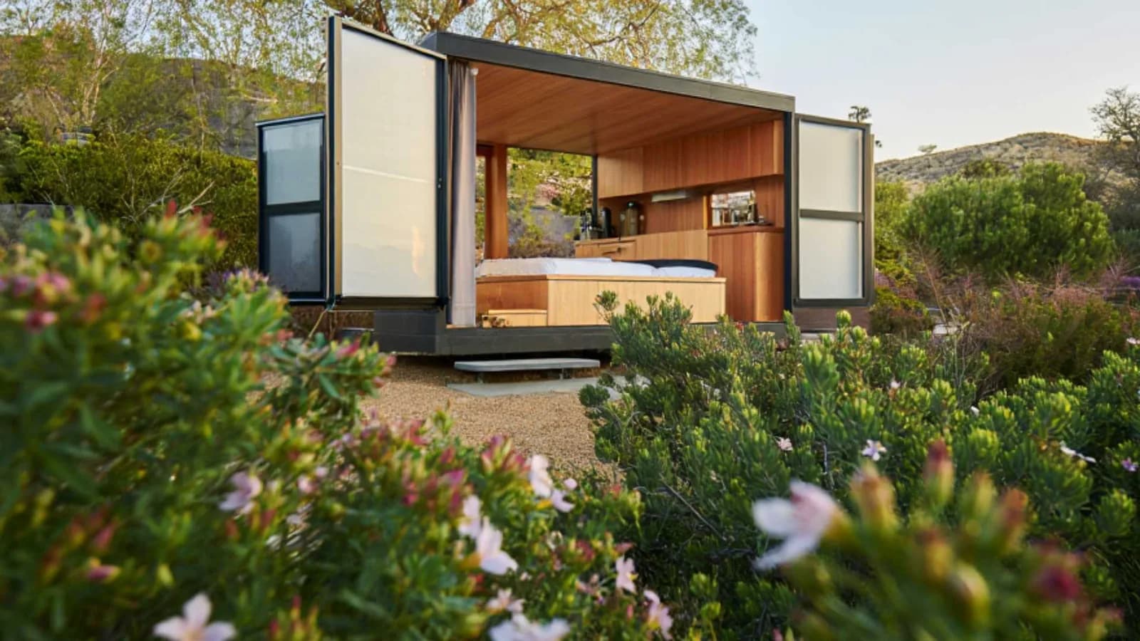 Prefab ADU kit with storage-style doors wide open