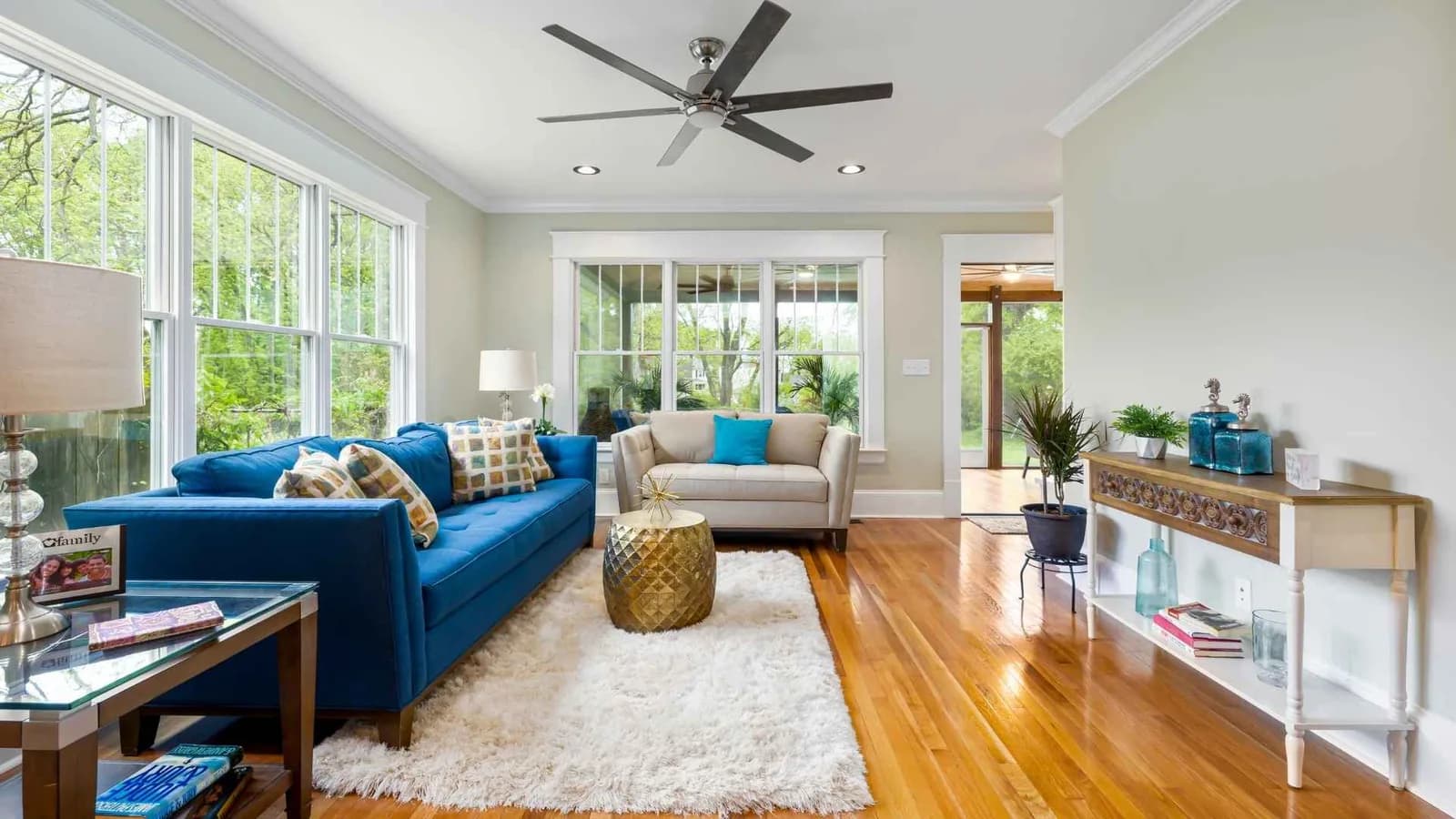 sitting room with rug and fan