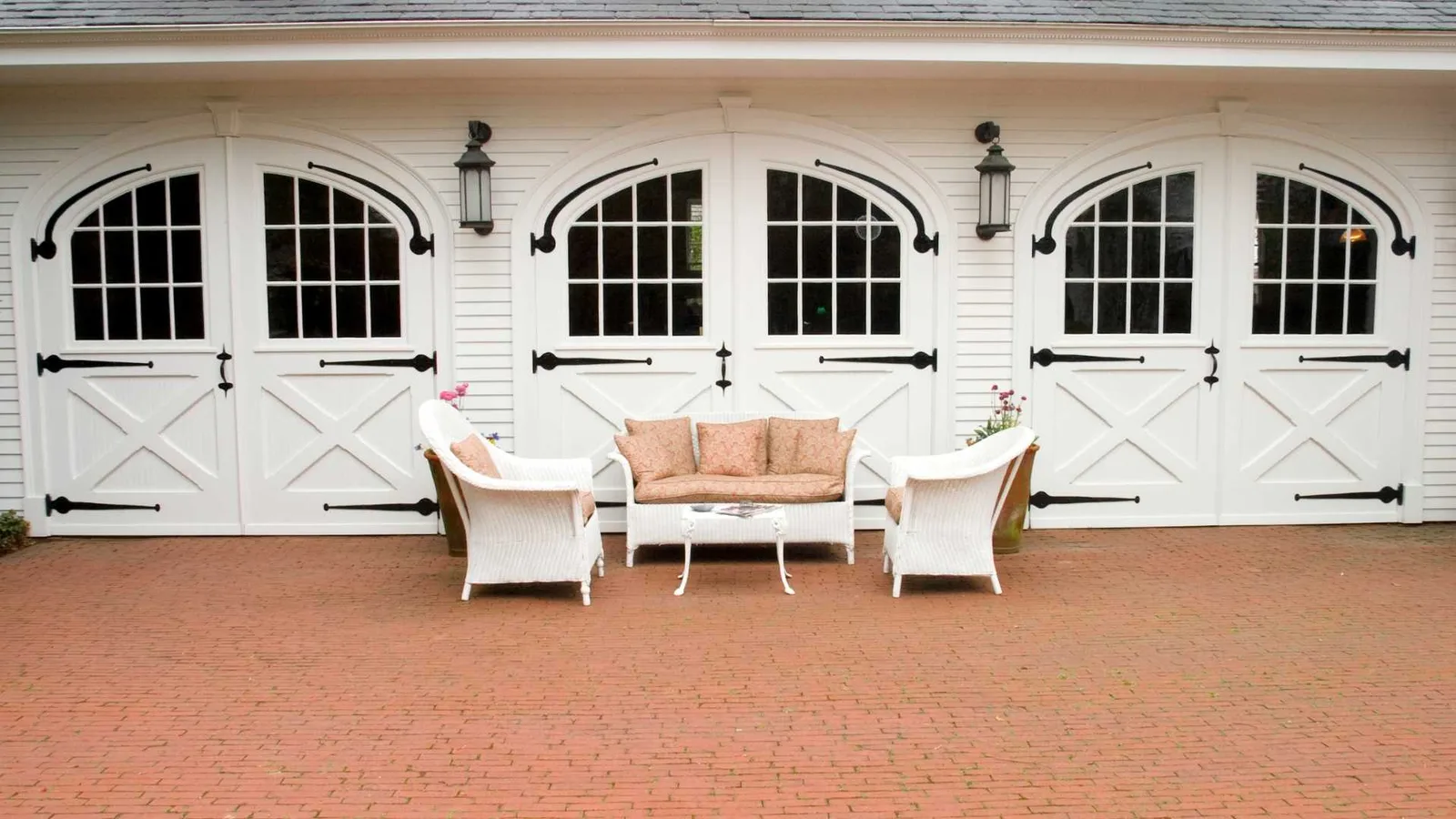 Three-car carriage house with apartment above the garage bays