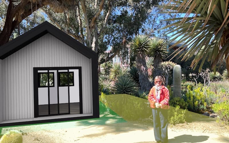 A backyard building shown in augmented reality next to a person