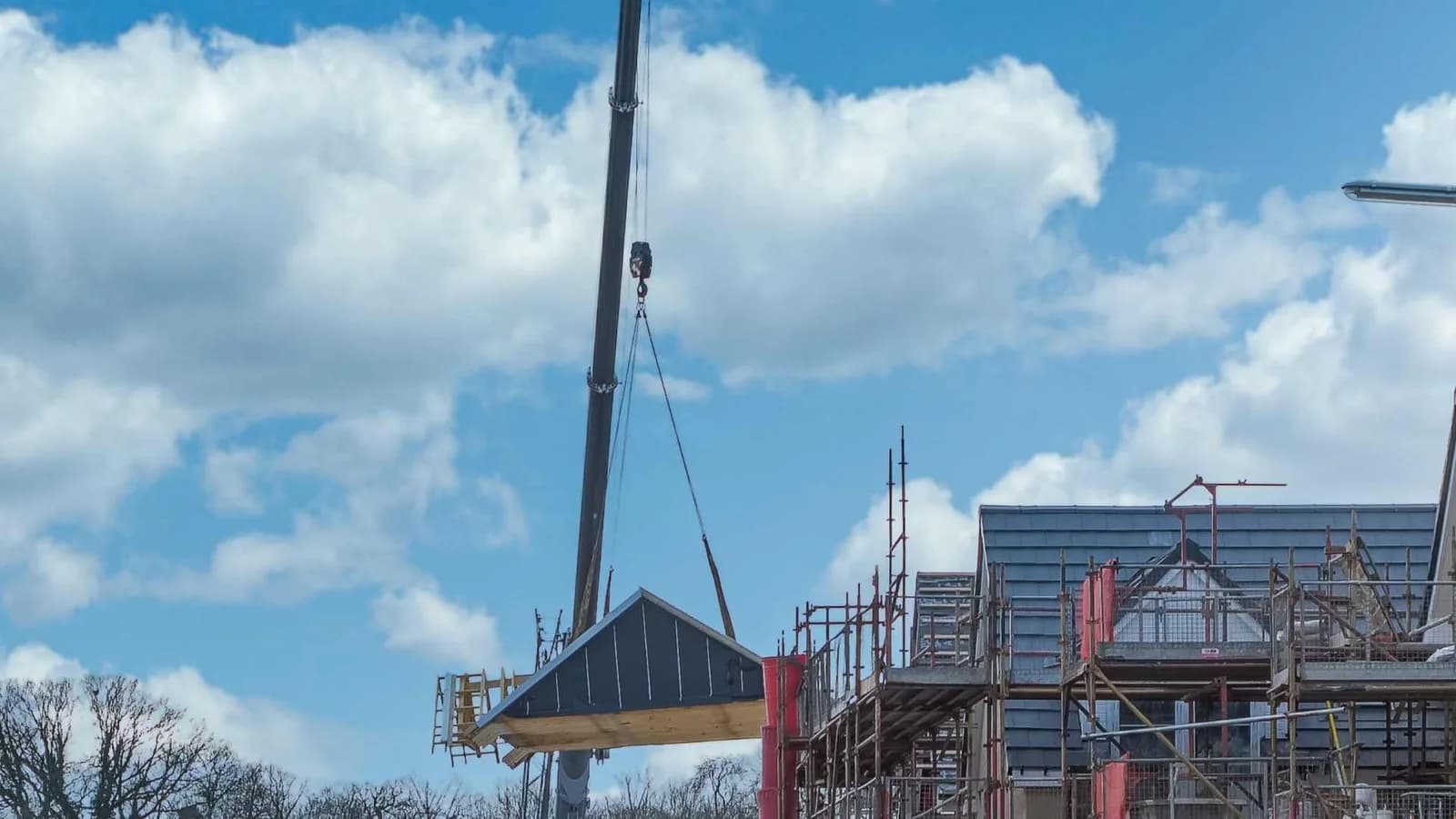Prefab roof on a crane